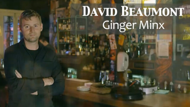 David Beaumont : Ginger Minx. Man standing in front of a wooden bar.