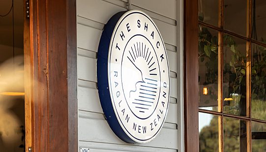 Exterior signage at The Shack, Raglan New Zealand