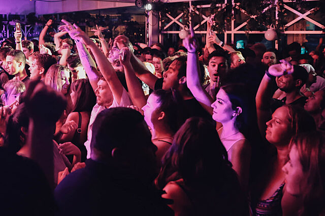 Crowd of people watching live music